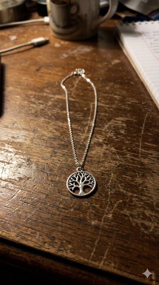 Jewelry photo before editing - silver necklace on wooden table
