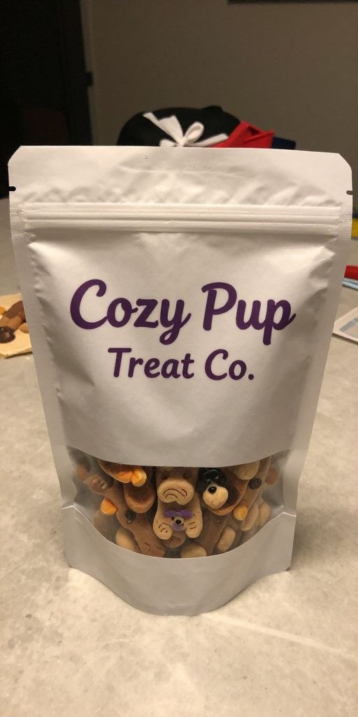 Before photo of a Cozy Pup Treat Co. dog treat bag on a countertop with distracting background clutter